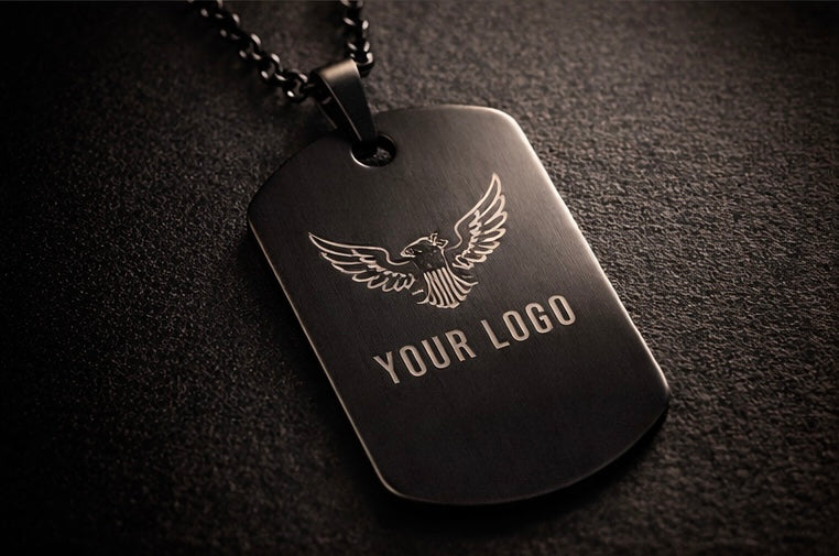 Black dog tag with eagle emblem and 'Your Logo' text on a dark background